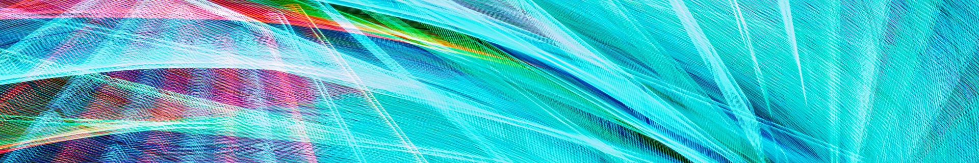 An abstract nighttime photograph of a sequenced LED light show at the Pacific Wheel, Santa Monica Pier, CA. The ferris wheel is stationary and movement is simulated by rotating the camera during a long exposure. The image features cyan and magenta rays that appear to emanate from two separate origins.